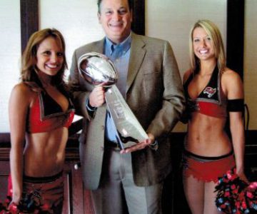 Dan Kost, holding Super Bowl trophy with the Tampa Bay Buccaneers cheerleaders